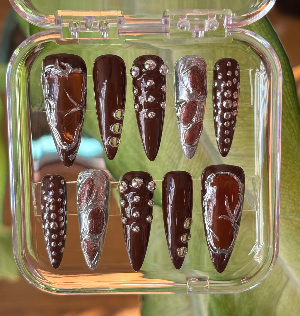 Dark brown and silver nails